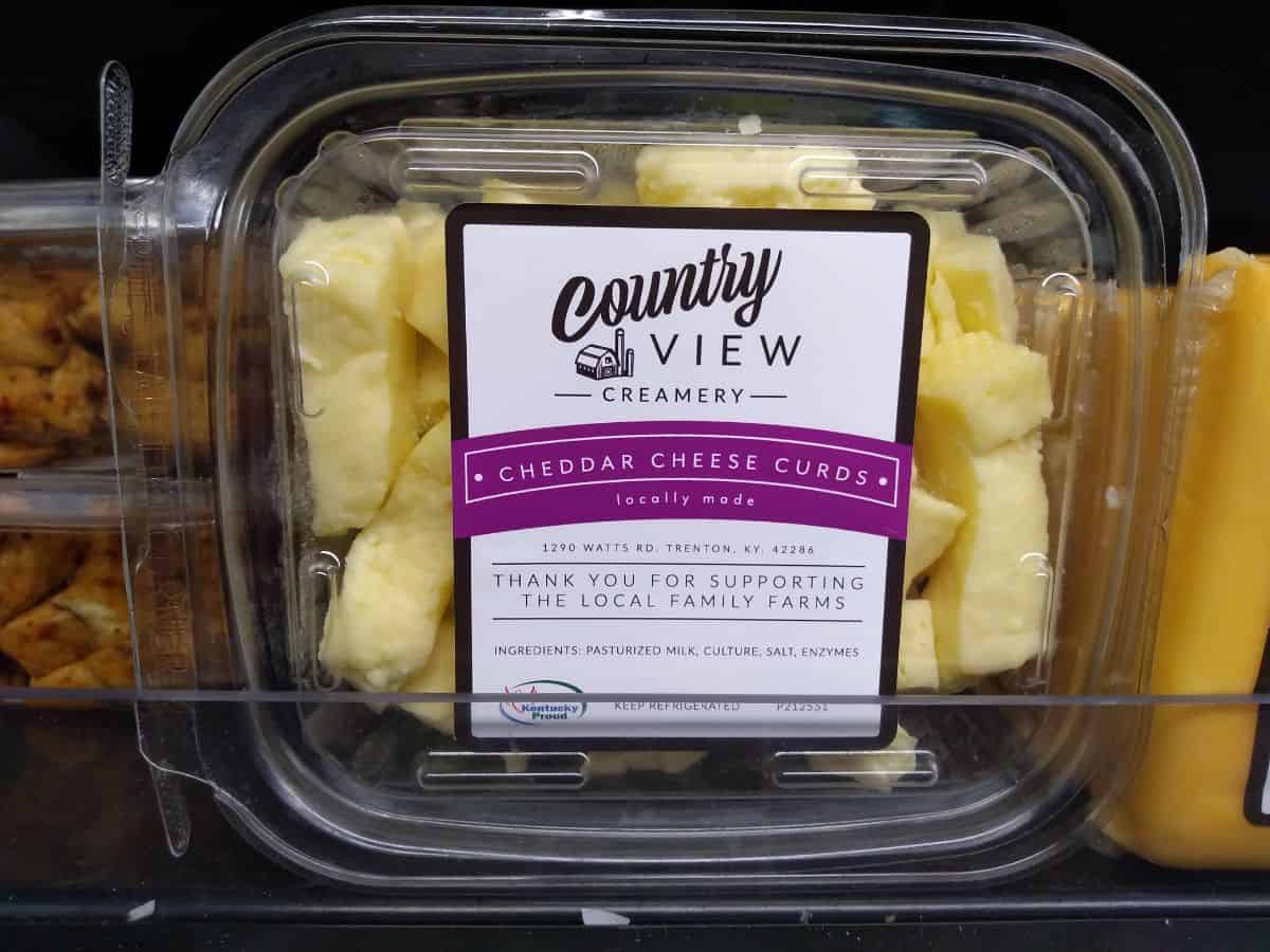 A clear plastic package of Country View Creamery Cheddar Cheese Curds.