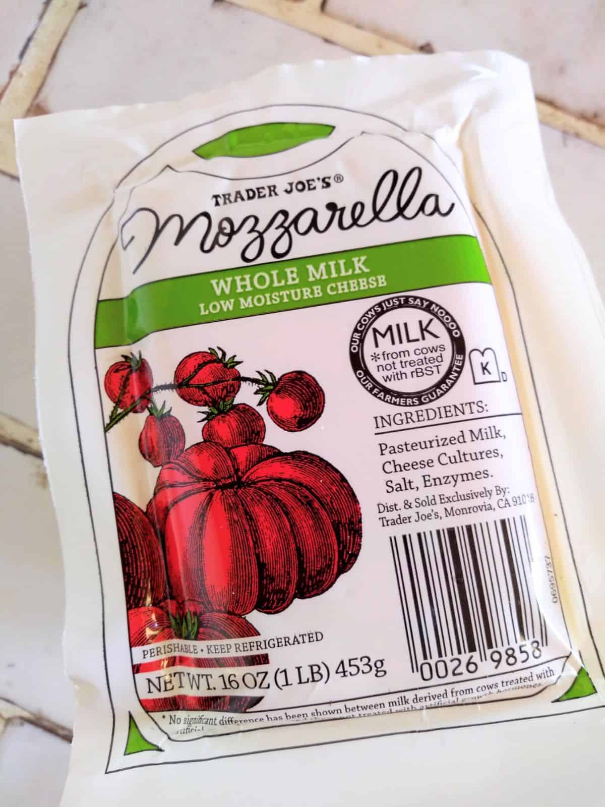 Trader Joe's Mozzarella Cheese sitting on a white title contertop.