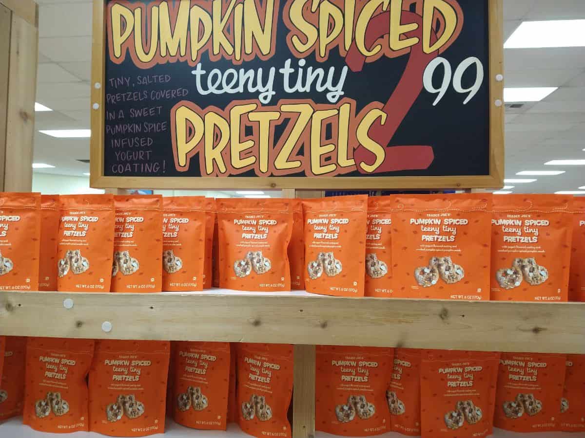 A display of orange bags of Pumpkin Spiced Teeny Tiny Pretzels.