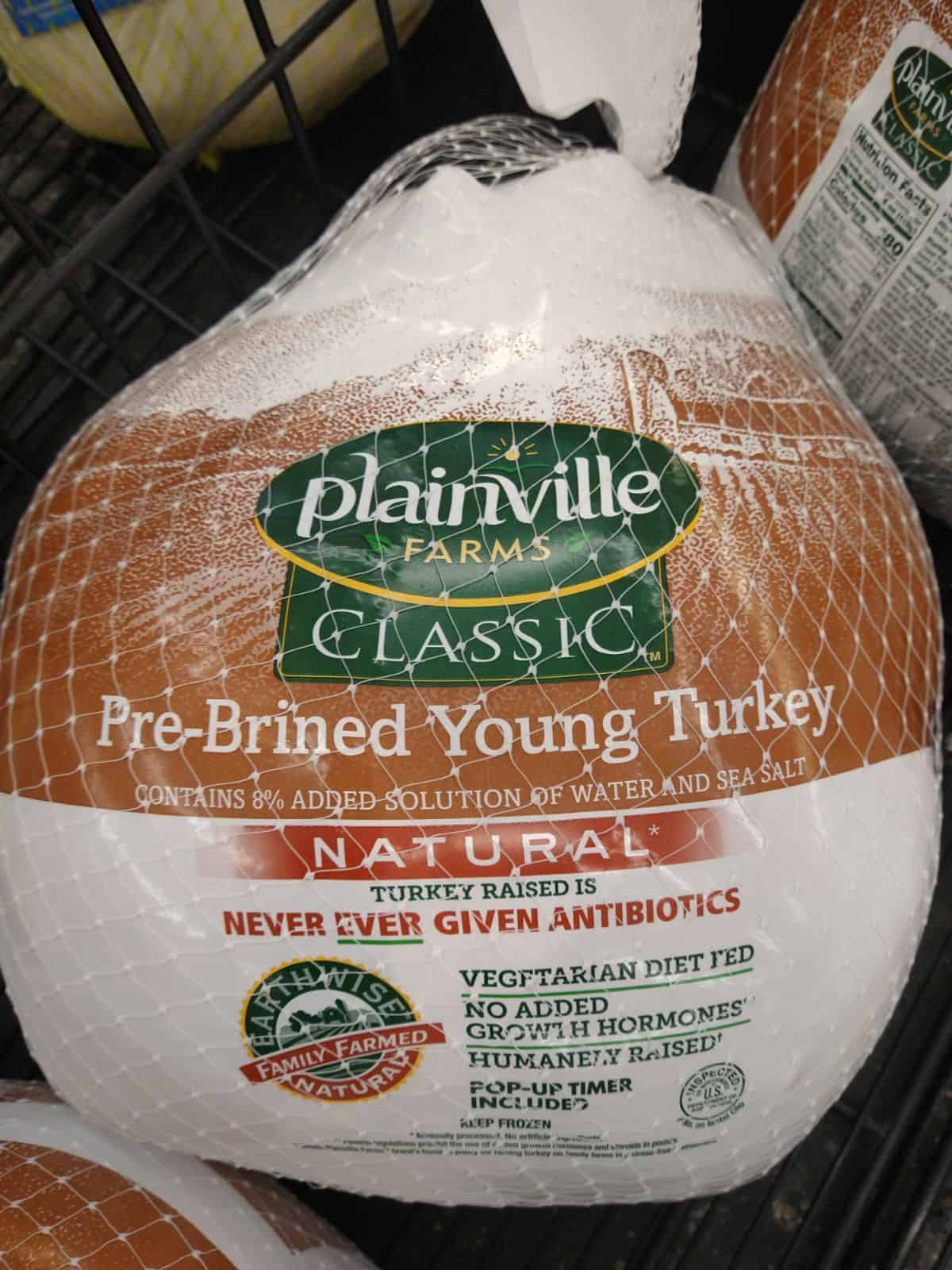 Plainville Farms Classic Pre-Brined Young Turkey in packaging at the store.