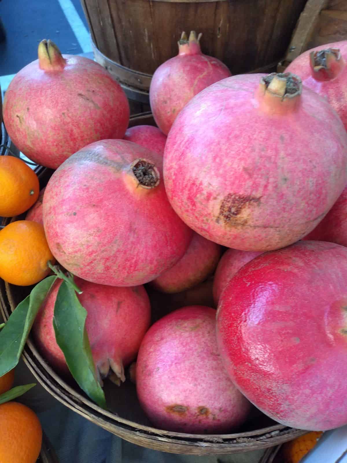 A stack of pomegranates at the farmers market