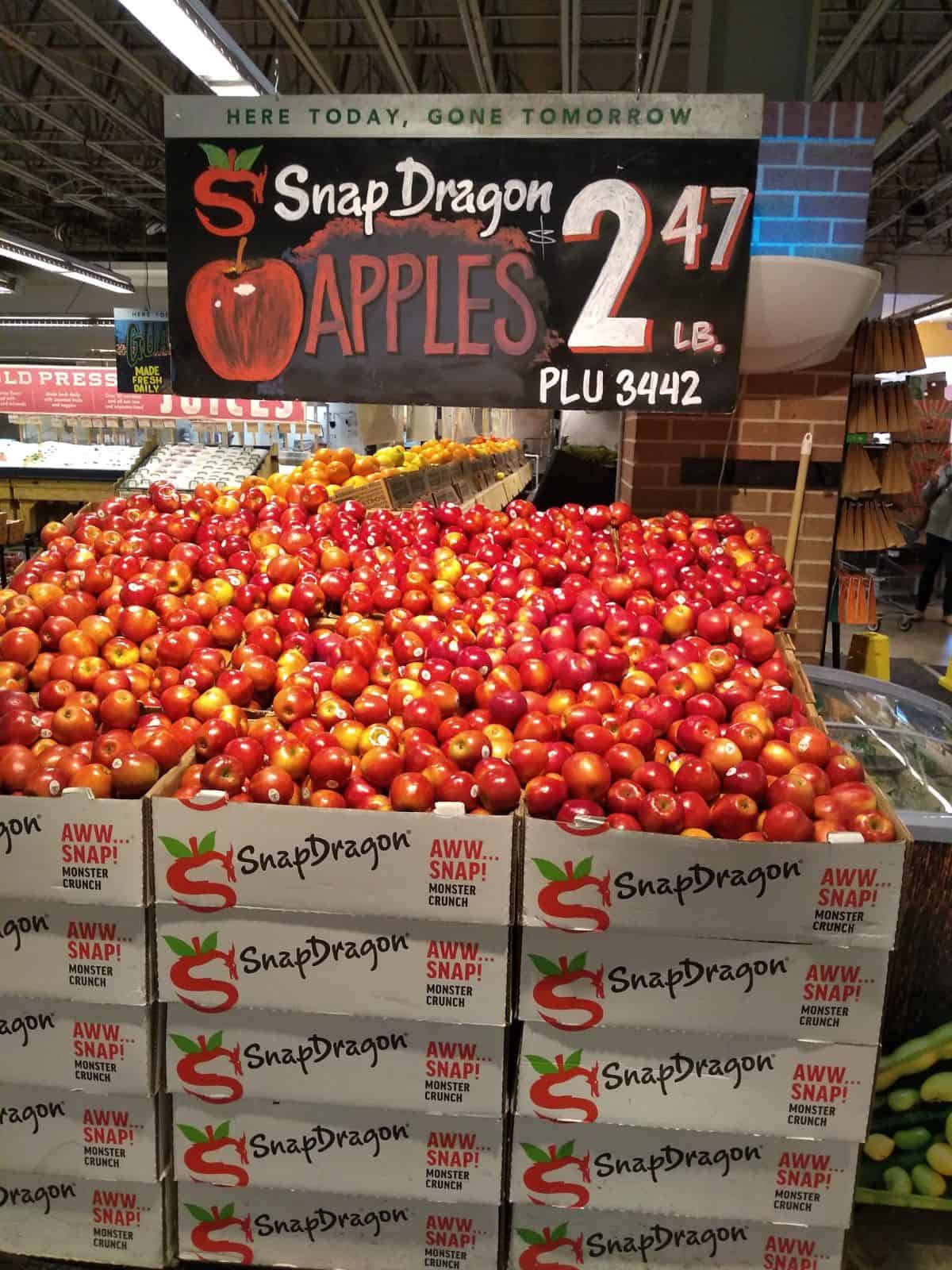 A display at a Central Market store of Snap Dragon Apples that are selling for $2.47/lb.