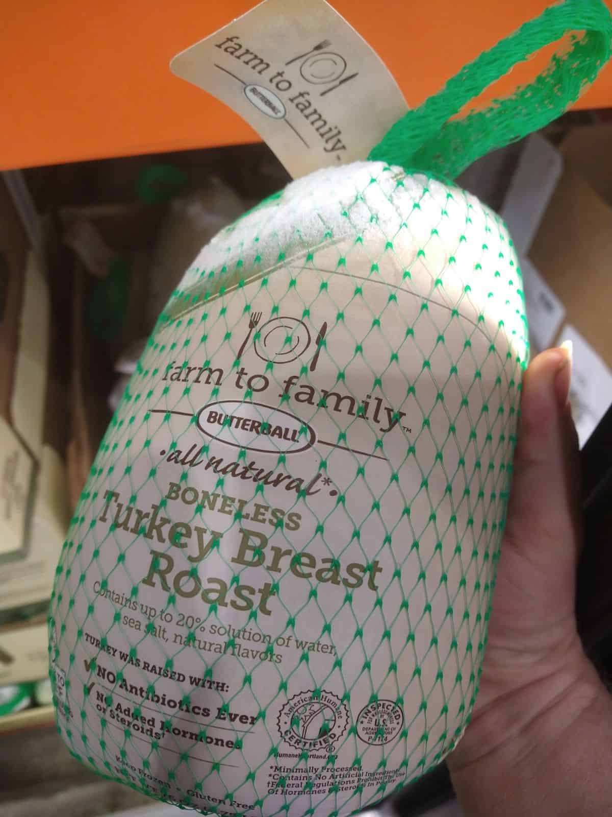 Farm to Family Butterball Boneless Turkey Breast roast in someone's hand.