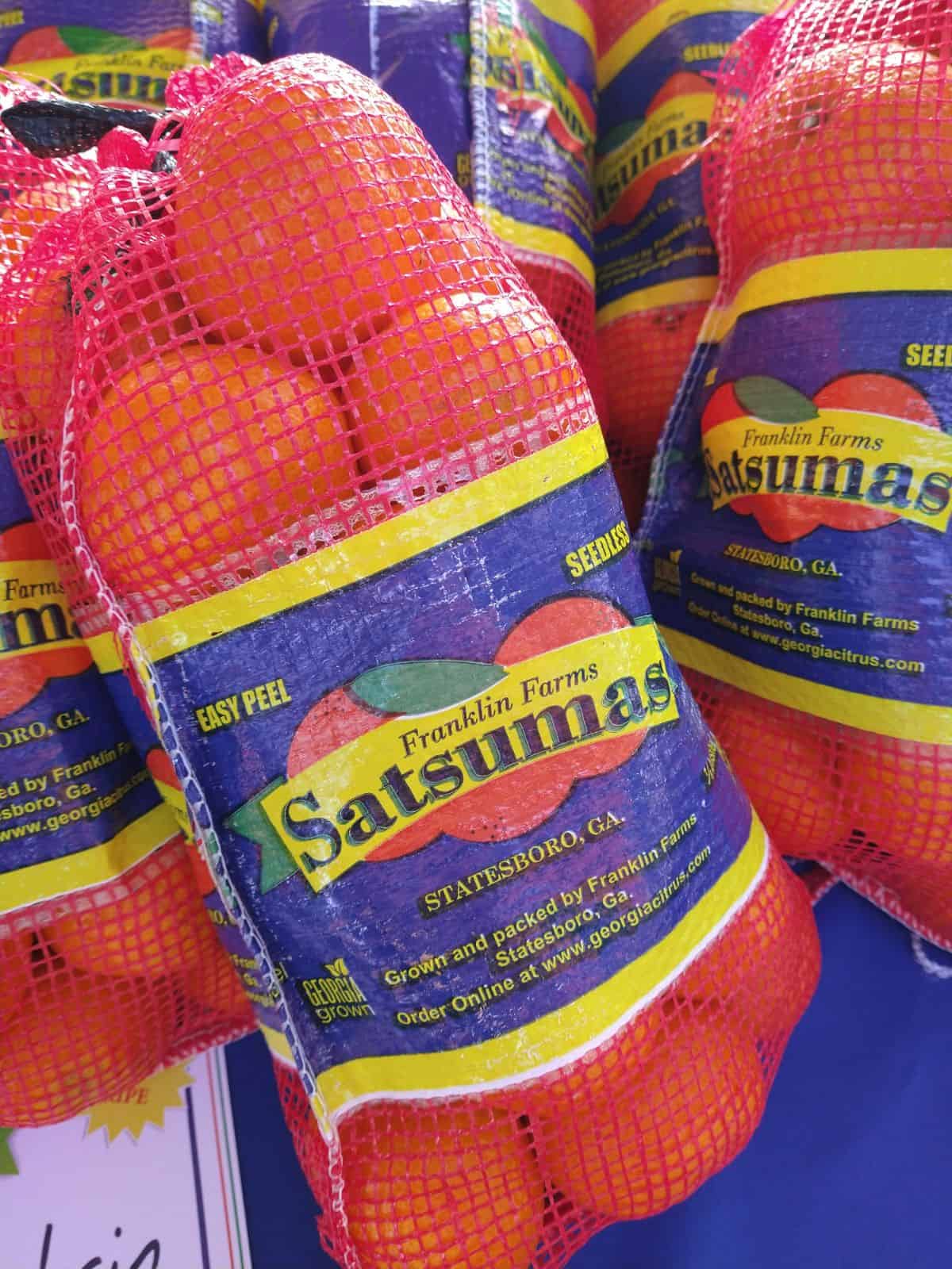 Bags of Franklin Farms Satsumas with a blue label. The label also says they are Georgia grown. 