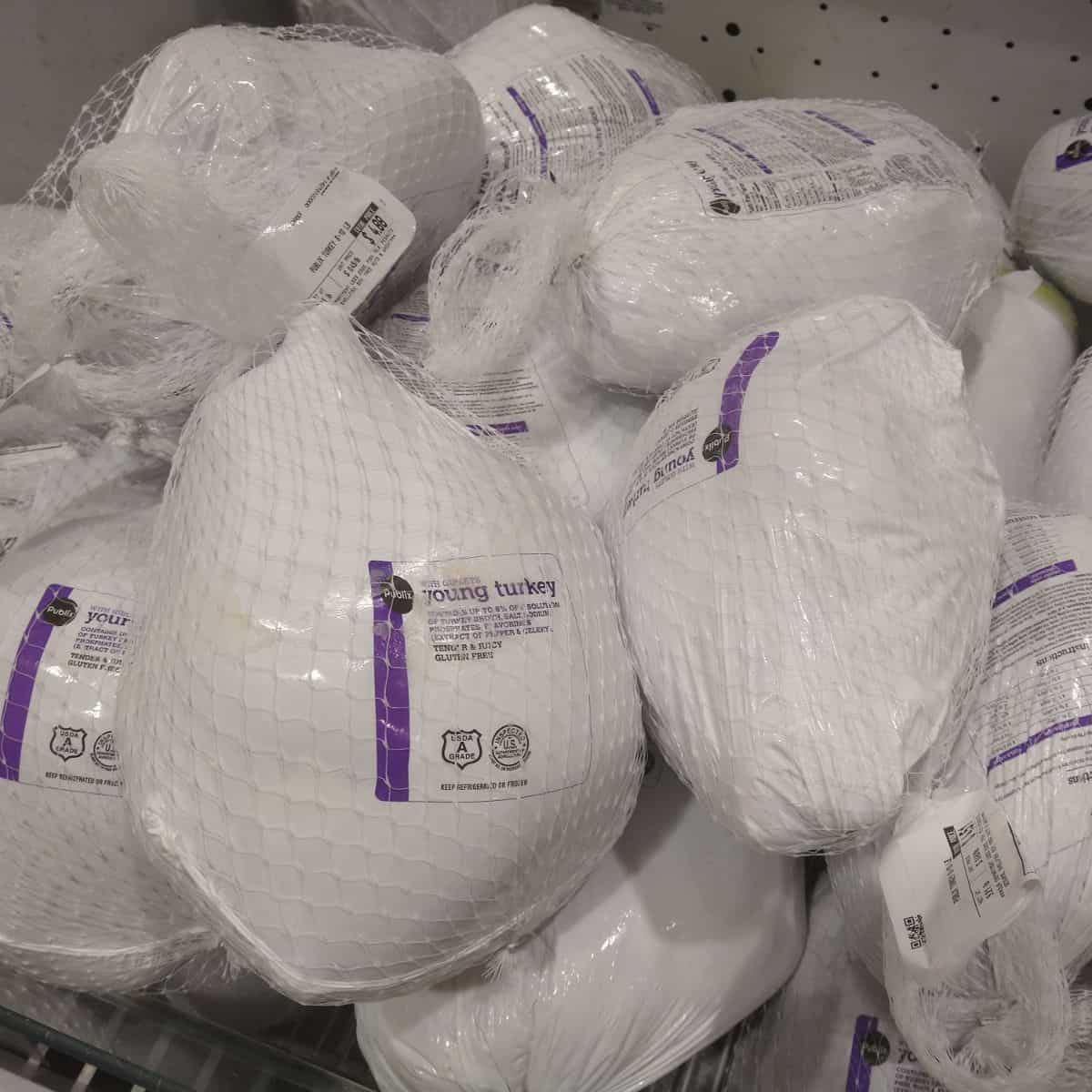 A display of Publix brand frozen turkeys in the case.