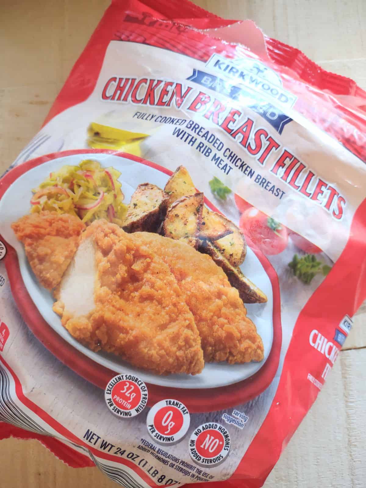 A red bag of Kirkwood Breaded Chicken Breast Fillets from ALDI