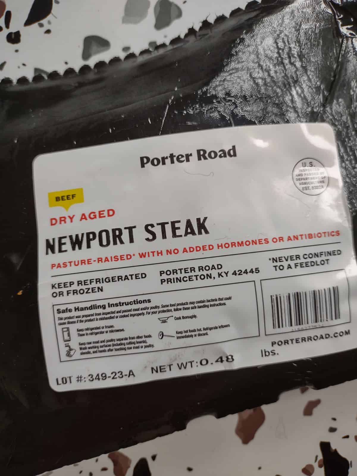 The back of a package of Porter Road Dry Aged Newport Steak. The steak weights 0.48 lbs.