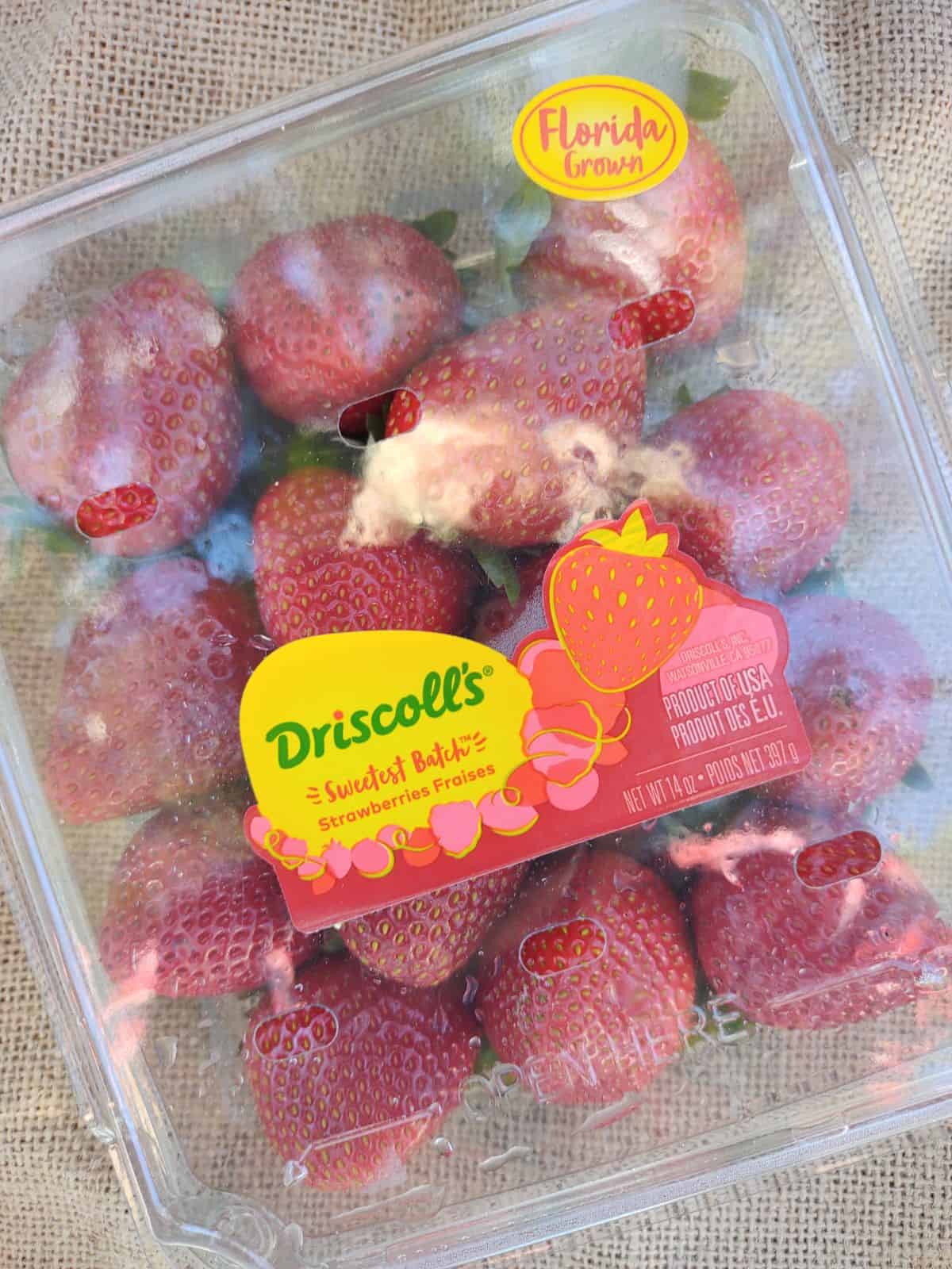 Driscoll's Sweetest Batch Strawberries on a piece of burlap.