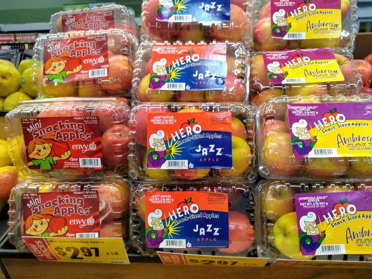 Clamshell containers of Hero snack sized apples including Envy, Jazz, and Ambrosia Gold seen at an HEB store in Texas.