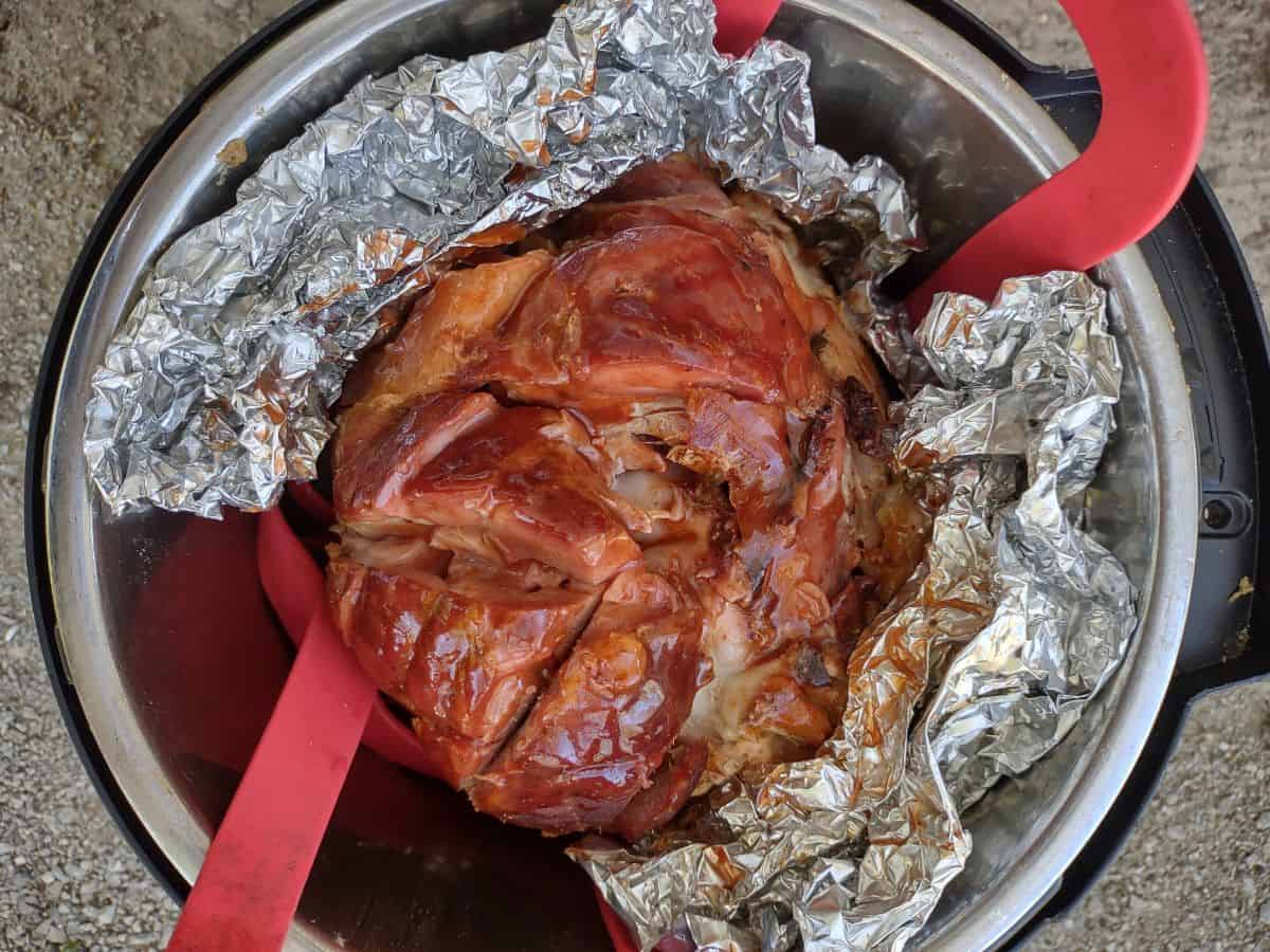 A ham brushed with a Cheerwine glaze in the Instant Pot with foil and a silicone sling. 