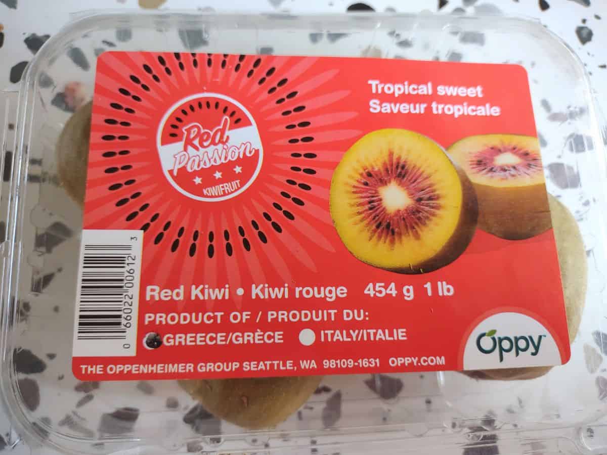 A clamshell container of Red Pssion Kiwifruit from Greece.