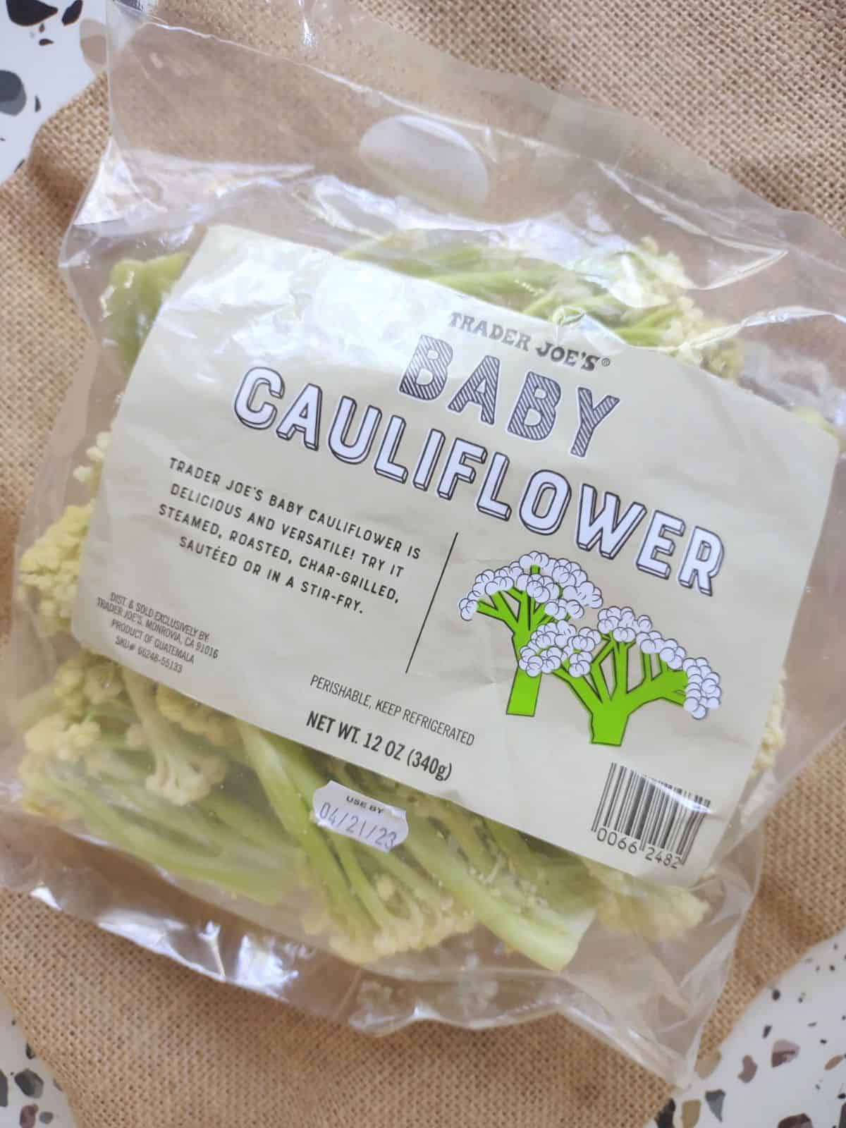 A bag of baby cauliflower from Trader Joe's on a table.