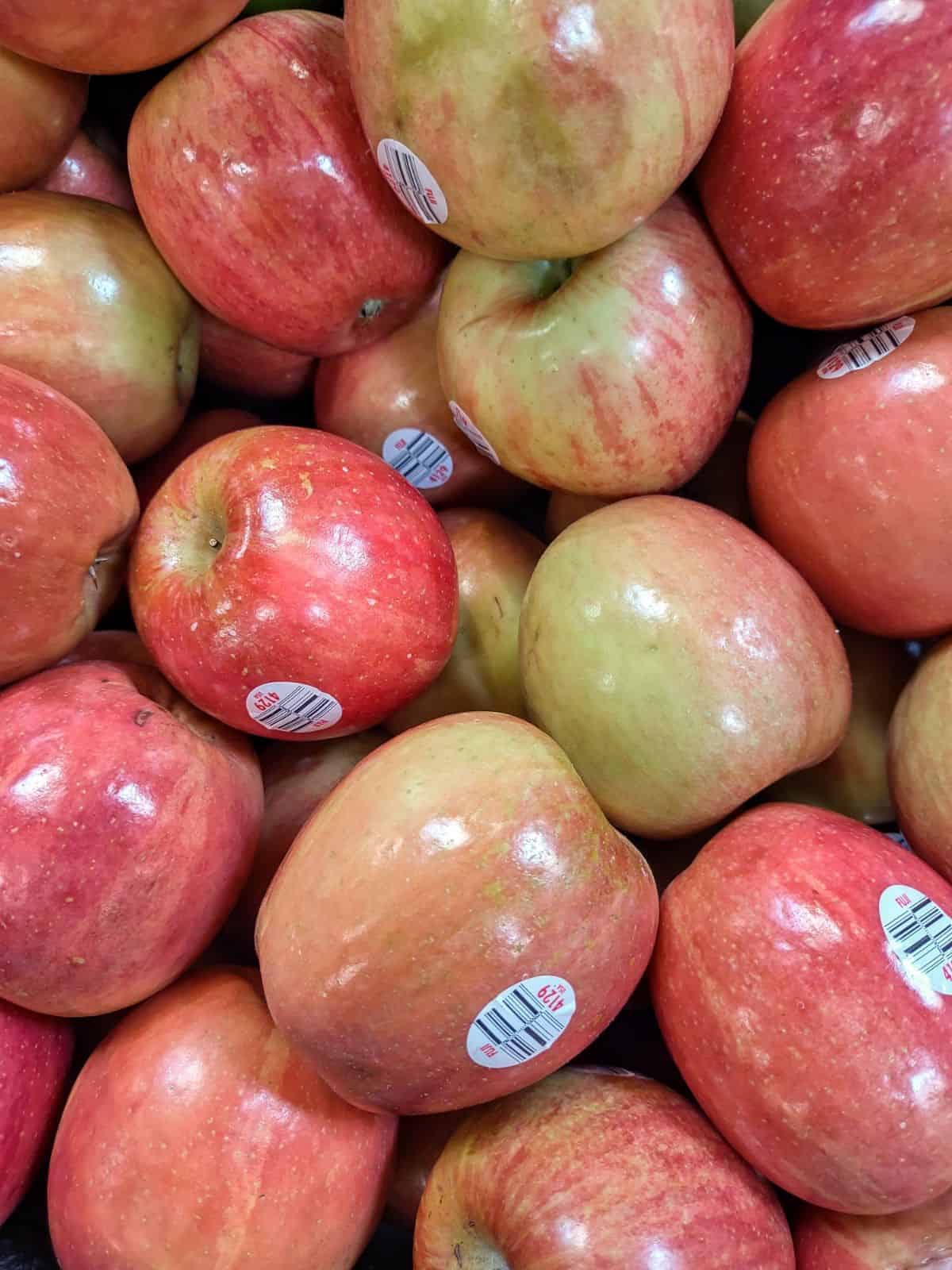 A close up of a display of Fuji apples at the grocery store.