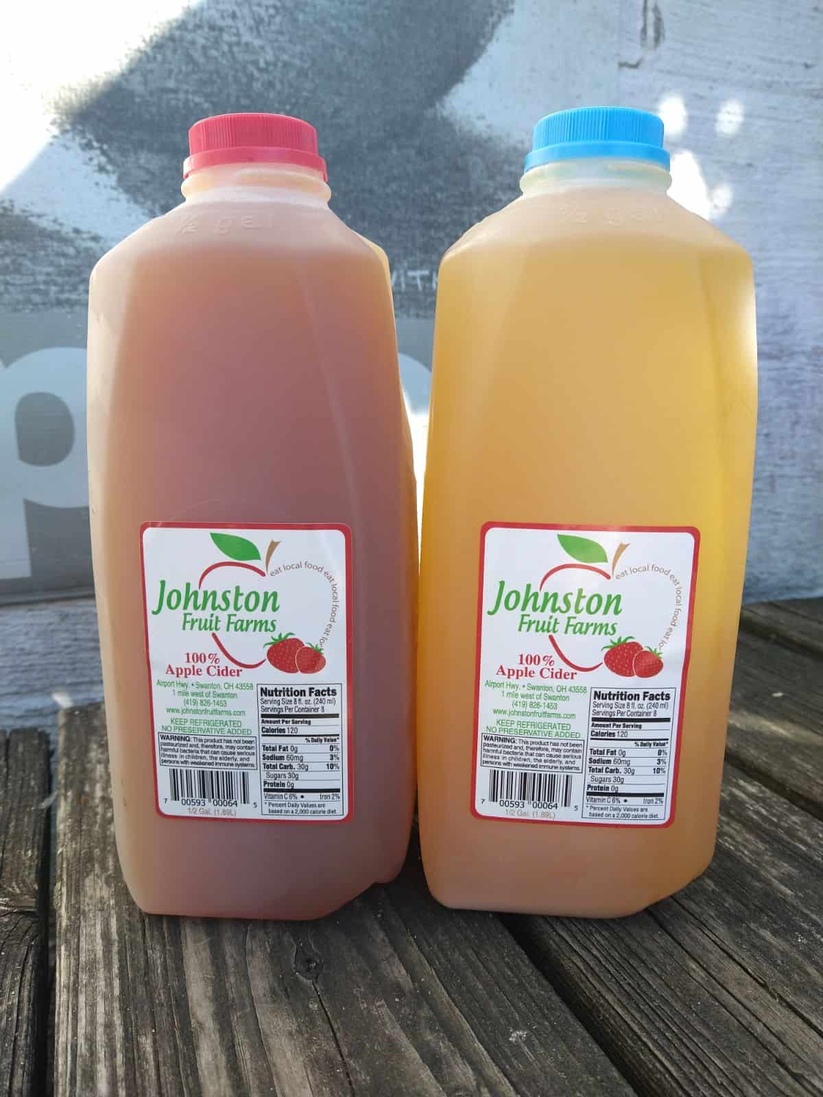 Johnston Fruit Farms 100% apple cider. The one on the left is a blend and the one on the right that is more of a little brown color is all Honeycrisp.