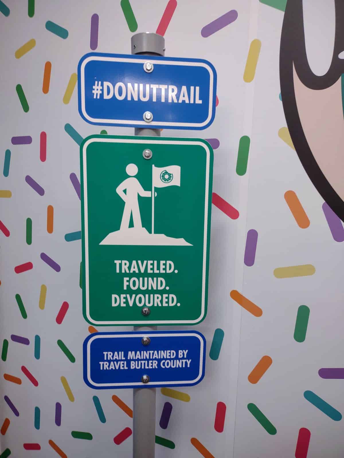 A donut trail sign made to look like a hiking sign.