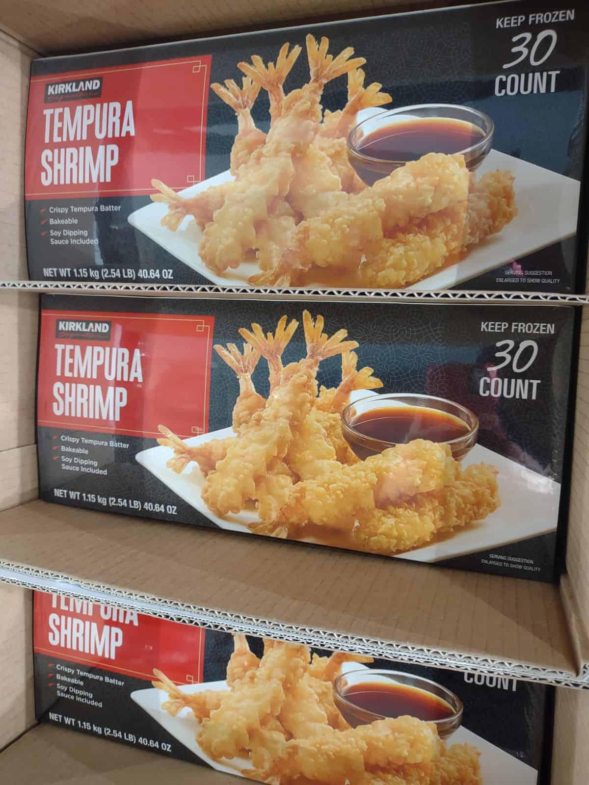 Boxes of Kirkland Tempura Shrimp on display in the freezer section at Costco.