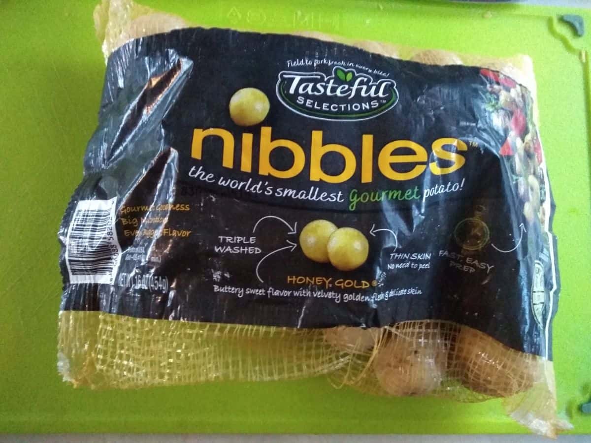 A bag of Tasteful Selections Nibble Honey Gold potatoes.
