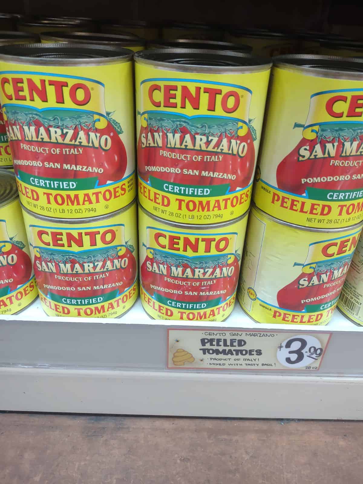 Yellow cans of Cento San Marzano tomatoes.