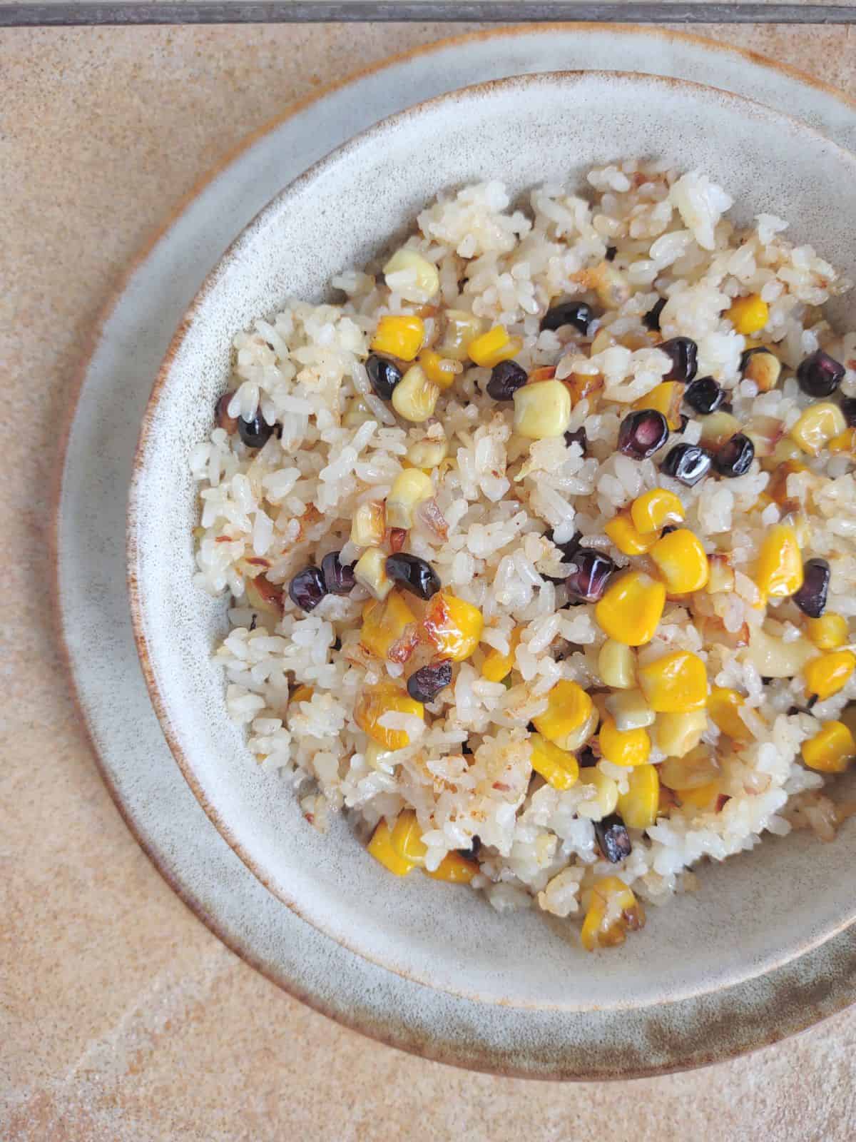 A bowl of fried rice with Stahlbush Island farms crazy corn.