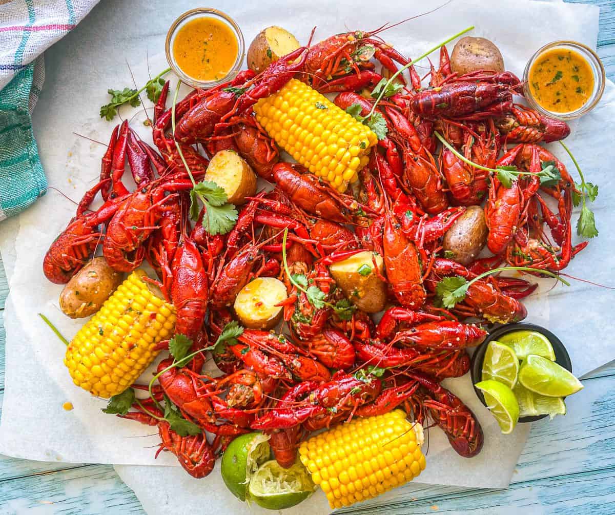 A crawfish bowl with corn and potatoes.