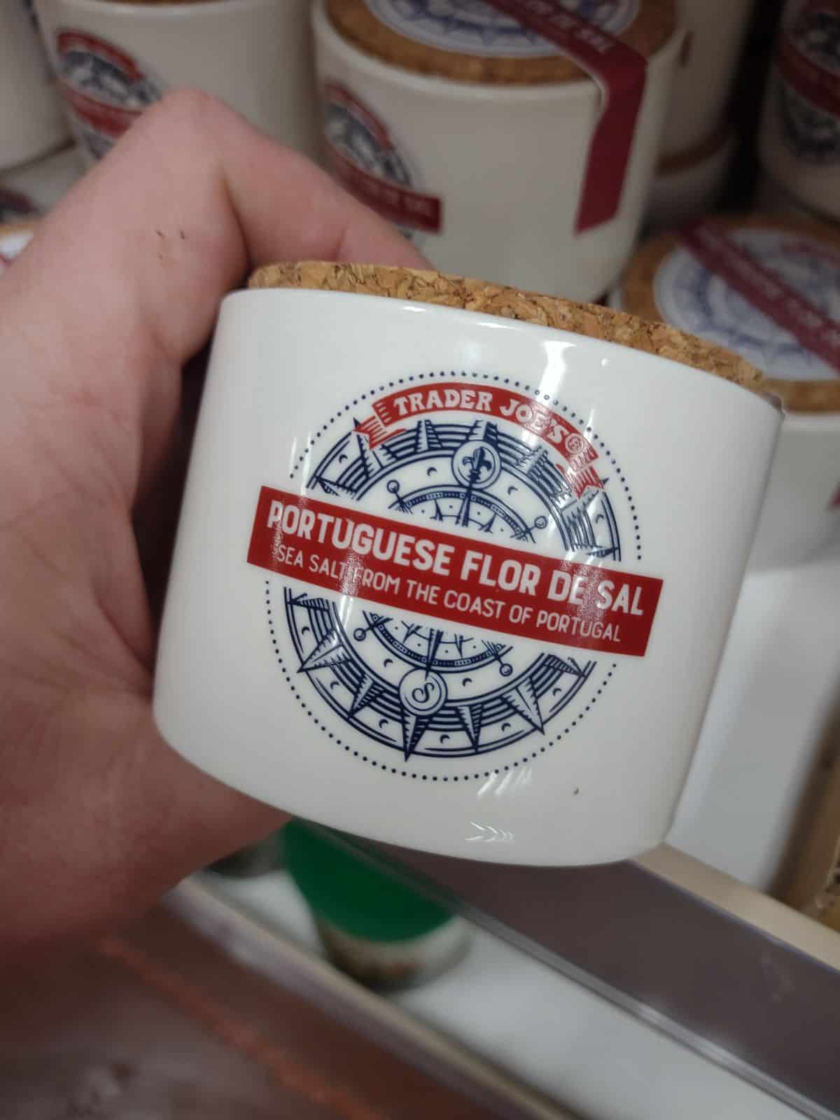 A white container of Trader Joe's Portuguese Flor De Sal salt.