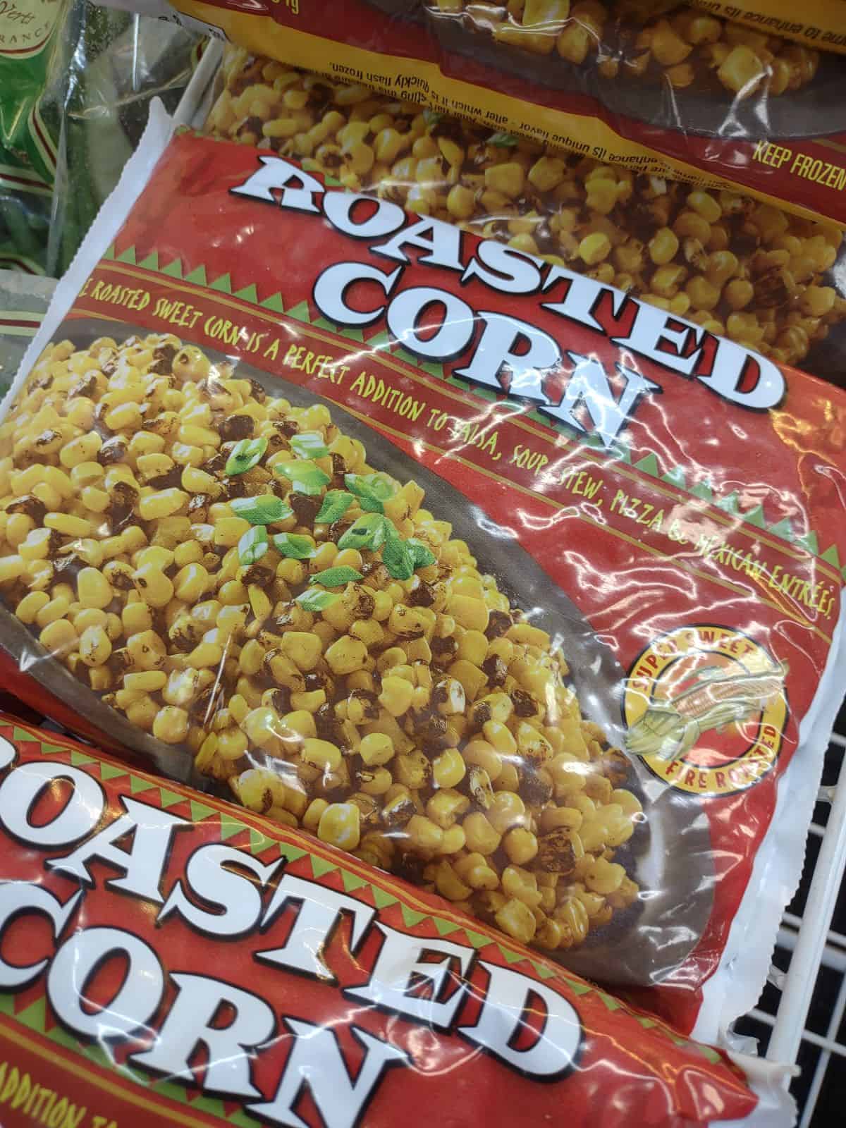 Bags of frozen roasted corn in the frozen section of Trader Joe's