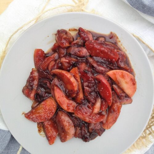 Fried apples on a gray plate that were made with Pink Pearl apples.