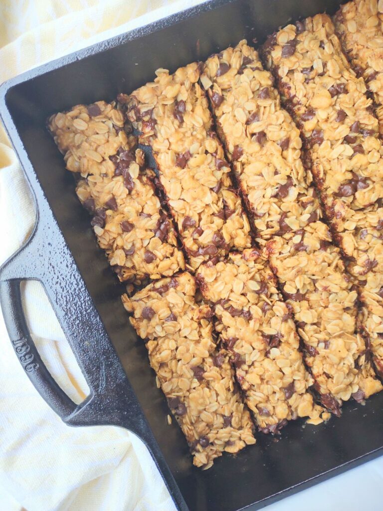 Tahini Chocolate chip granola bars in a cast iron pan.