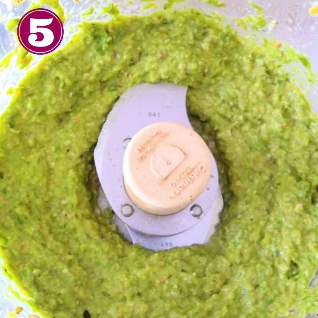 Step 5 showing finished asparagus pesto in the food processor.