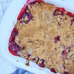 Strawberry Rhubarb Cobbler in a white baking dish.