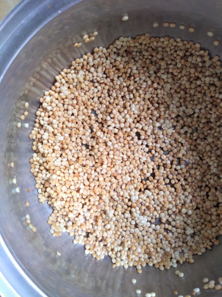 Toasted couscous in a pot.