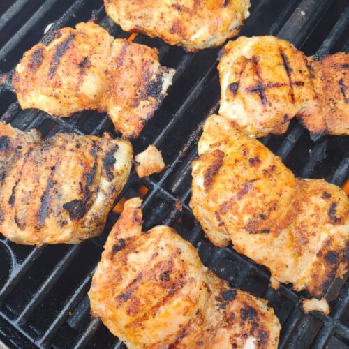 Dry rubbed chicken thighs on the grill.