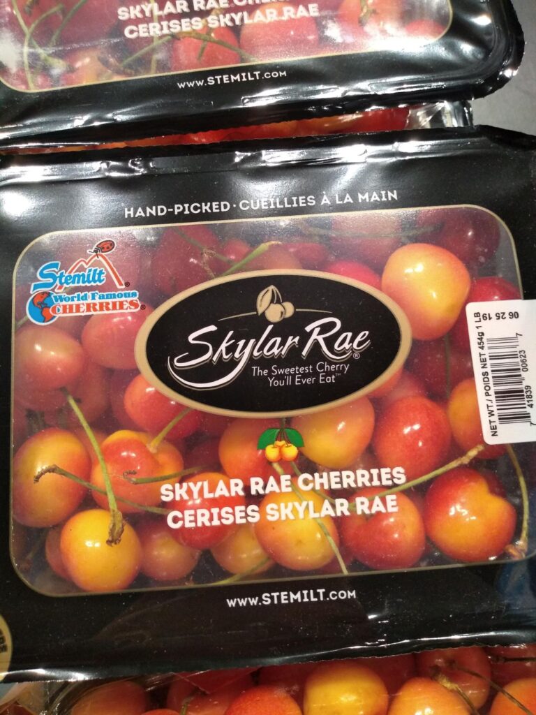 A black package of Stemilt Skylar Rae cherries at the store.