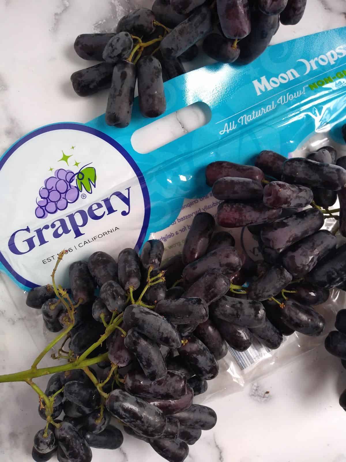 Grapery Moon Drops grapes on top of the bag.