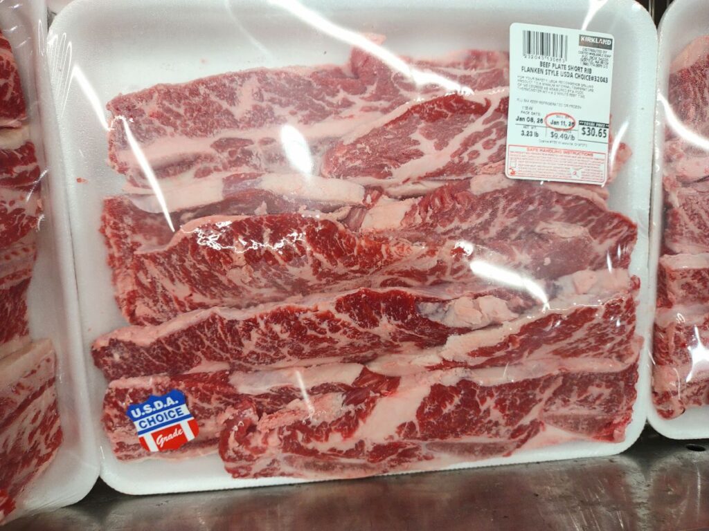Packages of beef plate short ribs flanken style on display at Costco