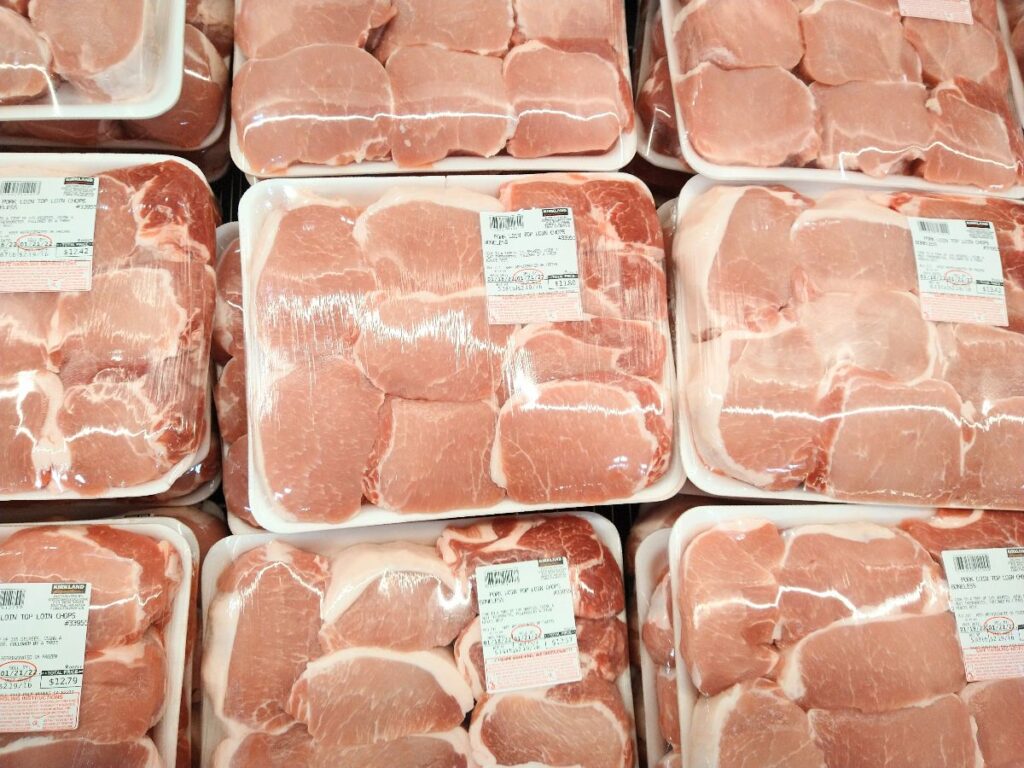 Packages on display at Costco of Kirkland brand boneless top loin pork chops