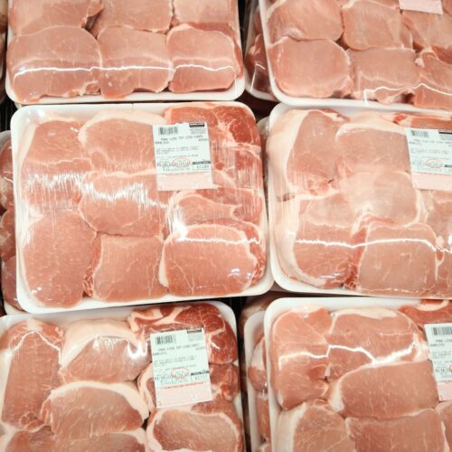 Packages on display at Costco of Kirkland brand boneless top loin pork chops