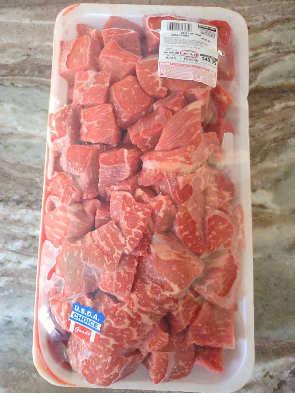 A package of beef stew meat from Costco sitting on the counter.