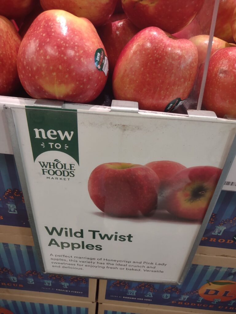 A display at Whole Foods Market of WildTwist apples.