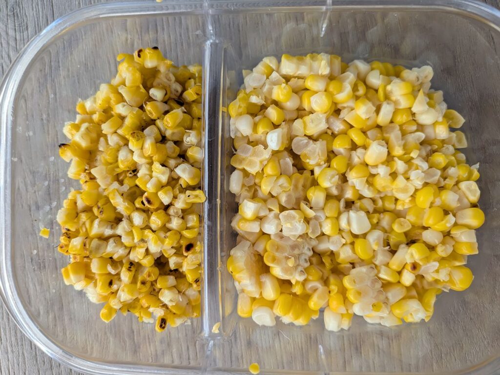 Smaller looking grilled corn kernels next to steamed corn kernels in a divided plastic container