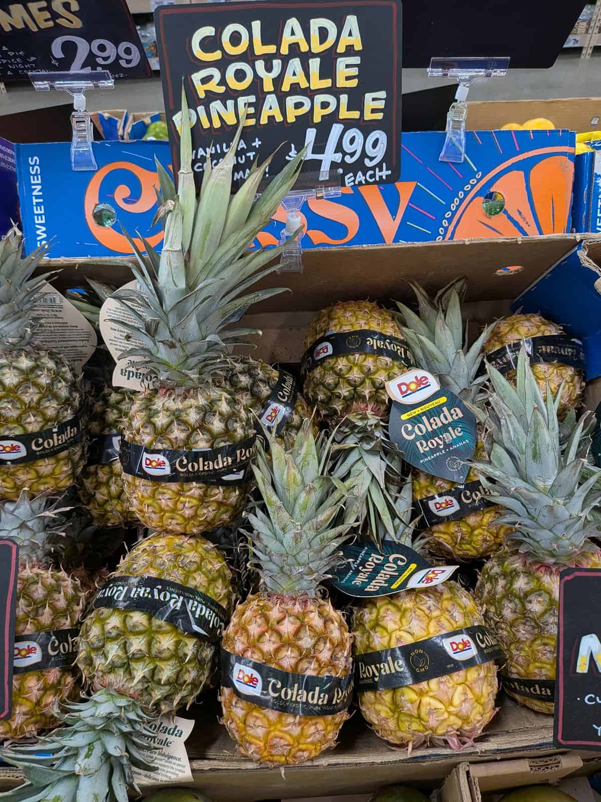 A display of Colada Royale Pineapple at Trader Joe's selling for $4.99 each