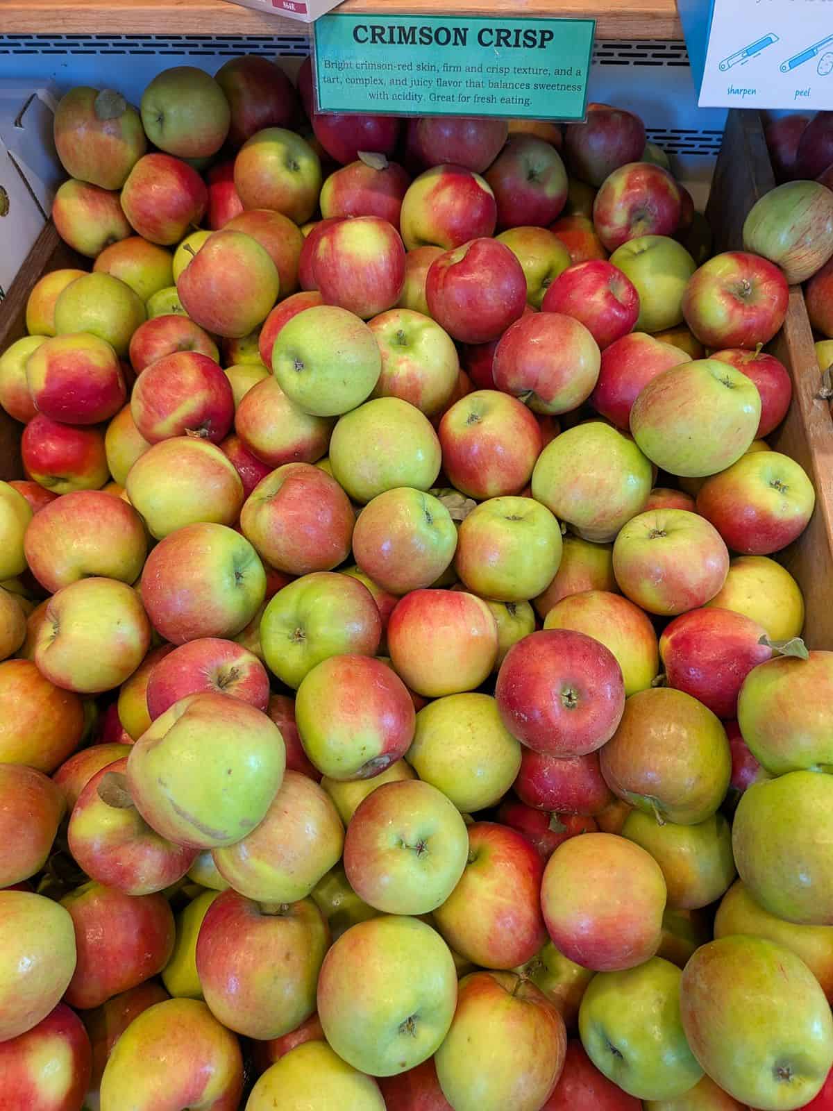 A bin of Crimson Crisp apples at a farm market in Oregon