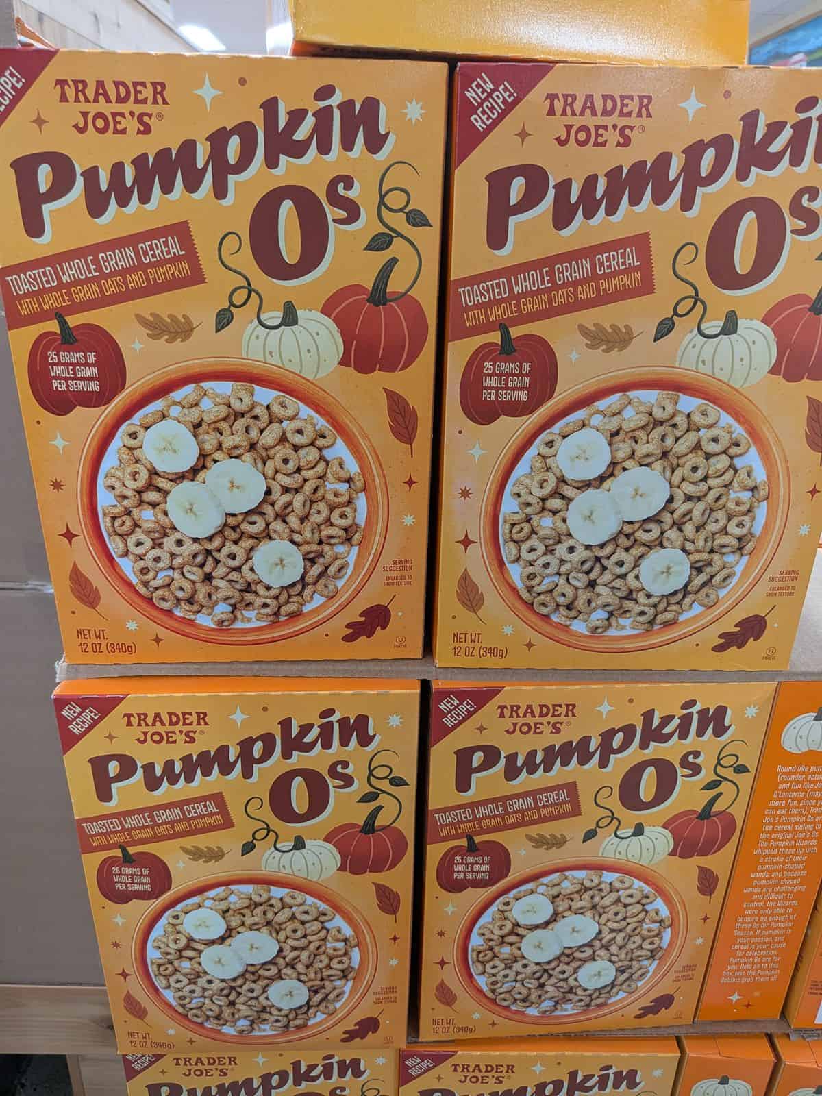 A display of boxes of Trader Joe's Pumpkin Os cereal. The box says that it is a new recipe.